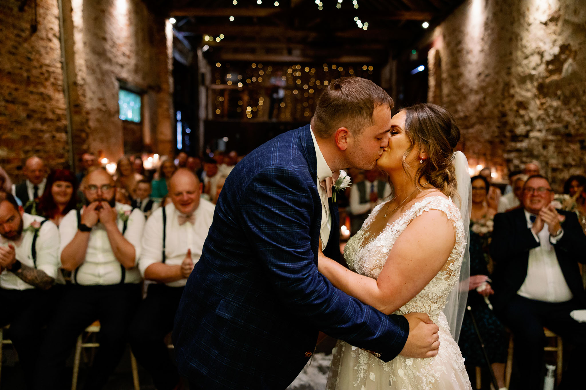 Bride and grooms first kiss as man and wife