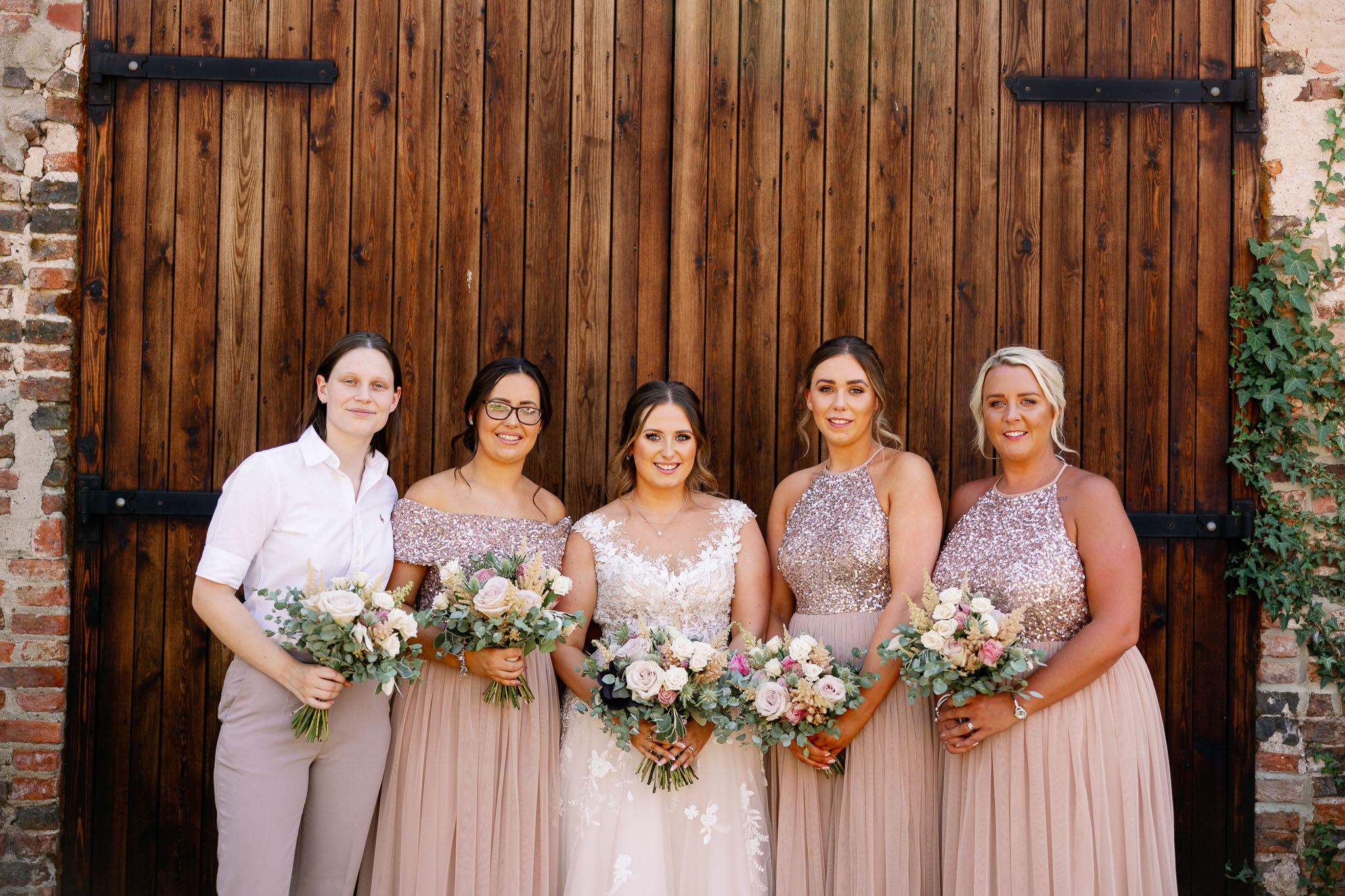 Bridesmaids wearing blush