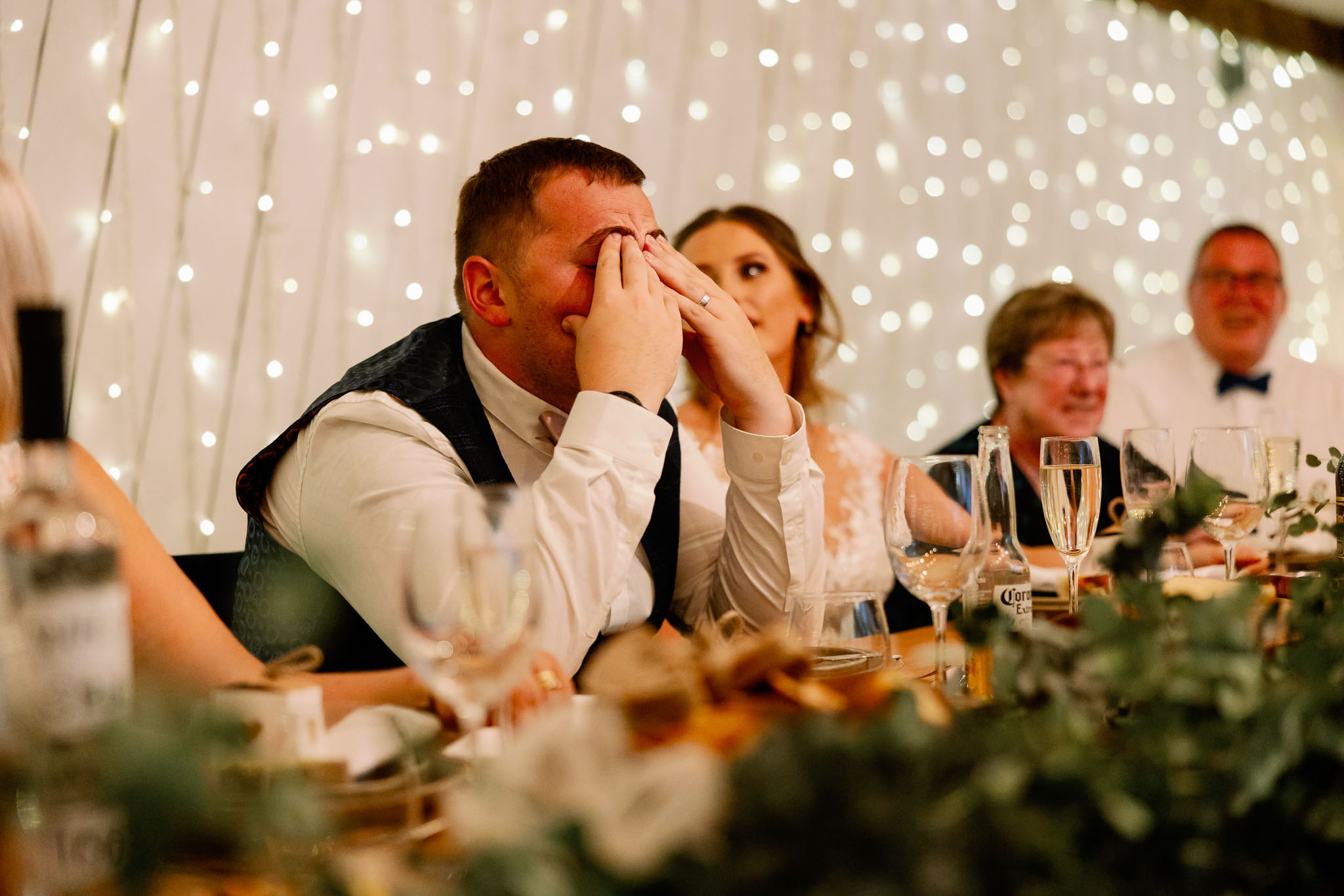 Embarrassed groom during speeches 