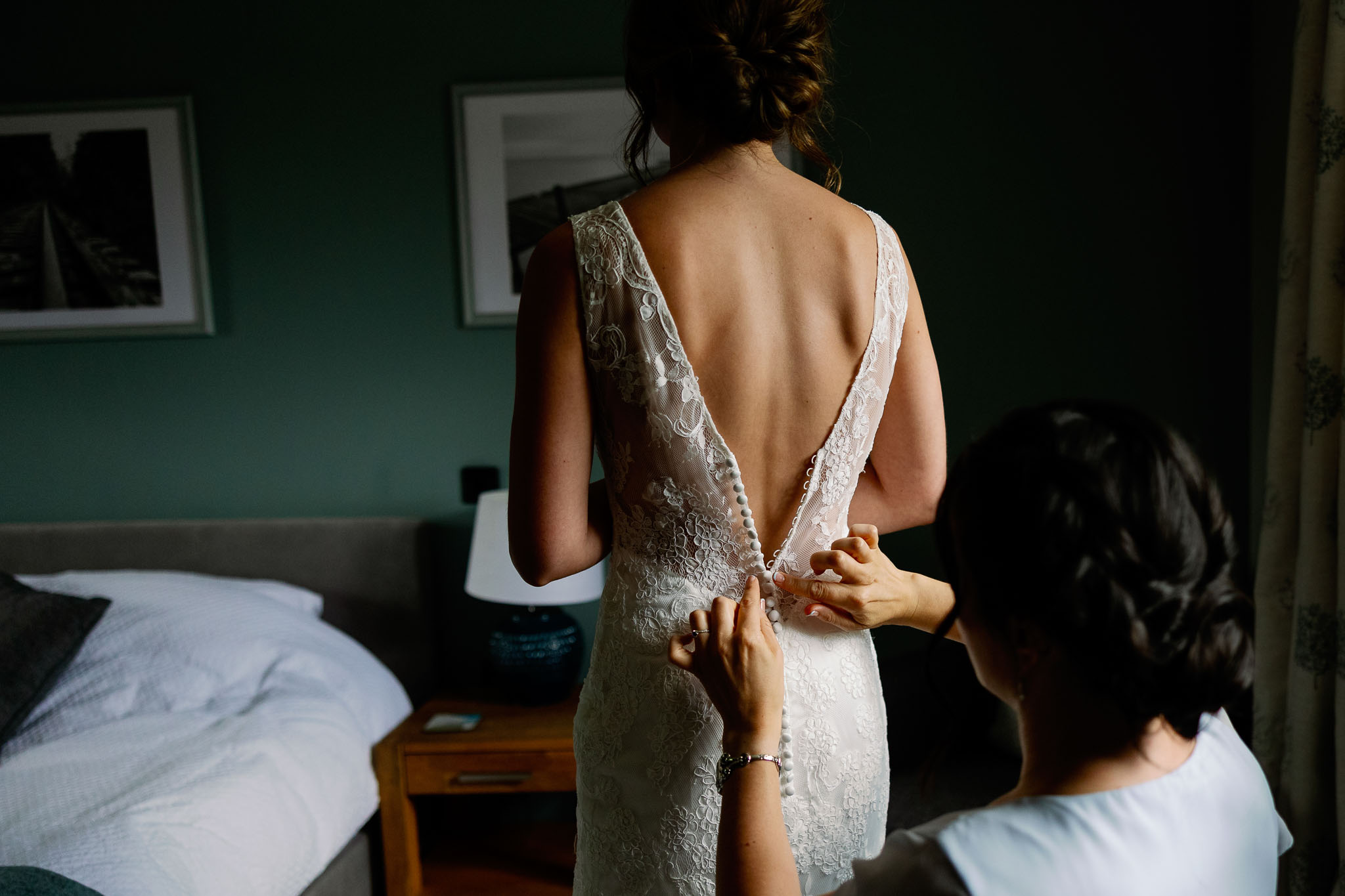 Bride getting dressed for her wedding 
