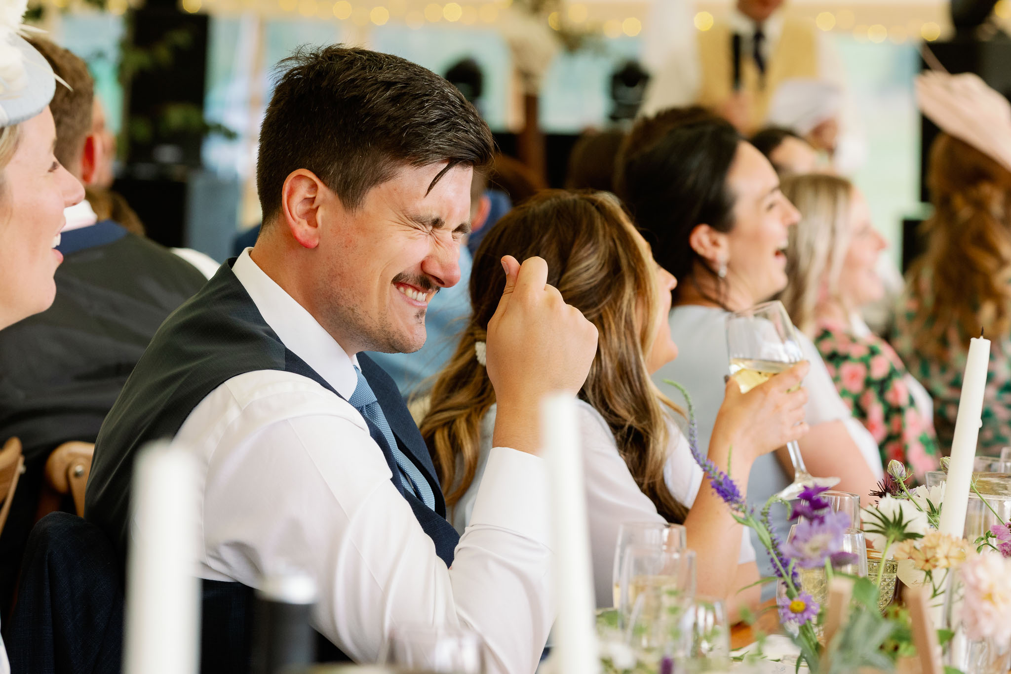 Happy laughing guests at a wedding 