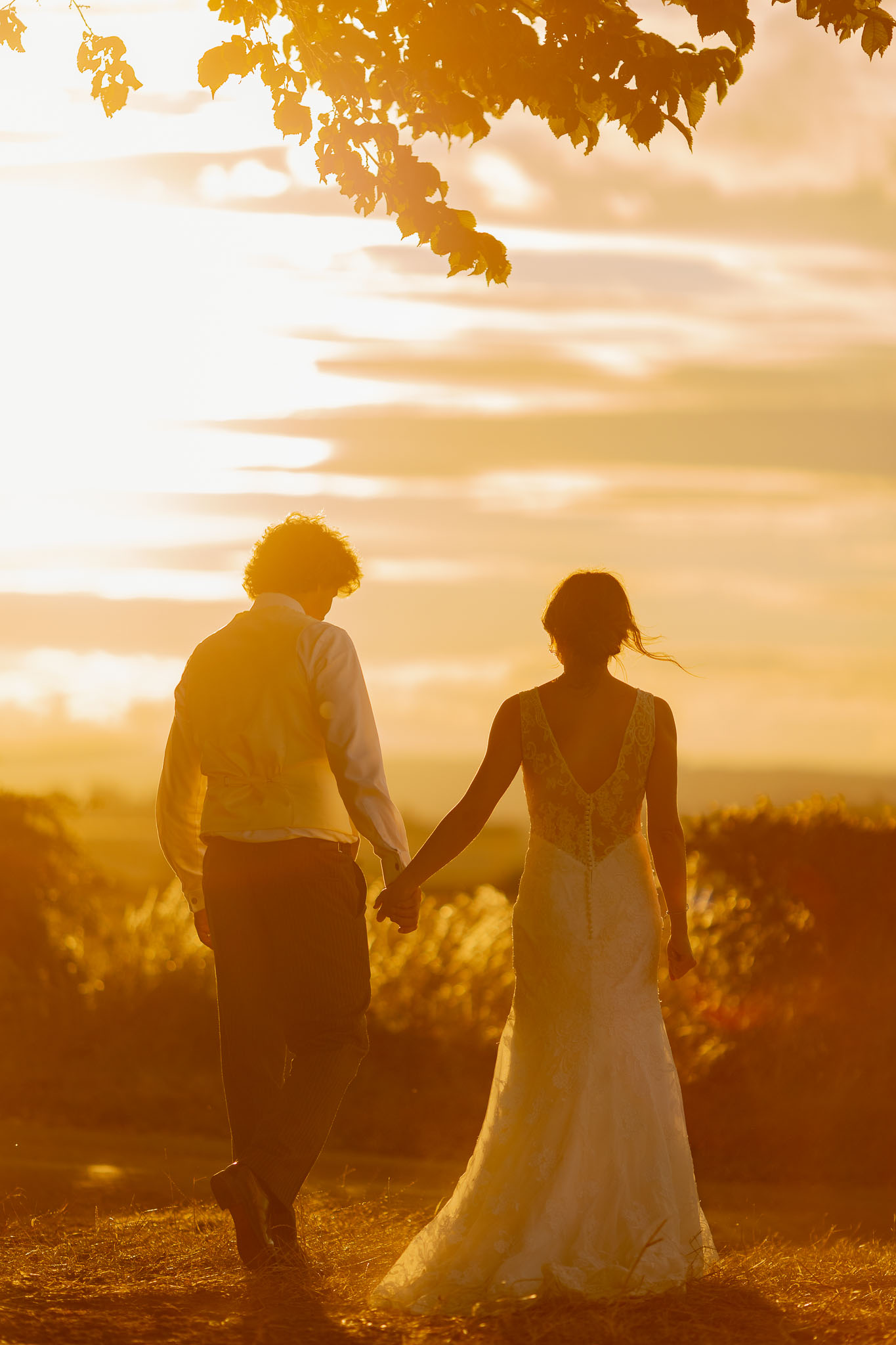 bride and groom in golden light on theor wedding day in Yorkshire near Leeds 