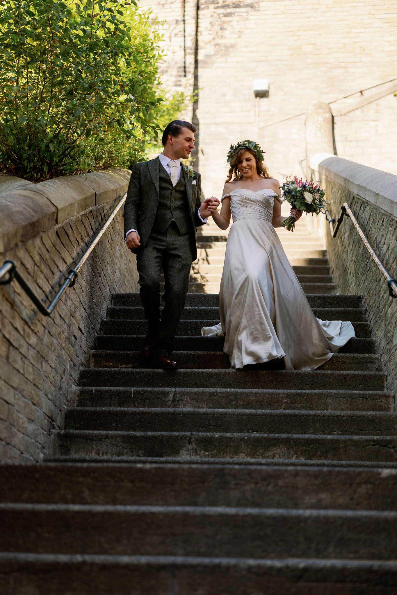 Bride and groom walking down stairs in Halifax 