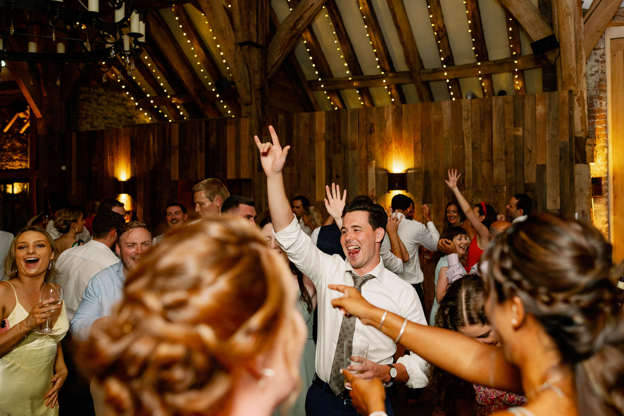 Fun and colourful wedding dancing pictures in a barn Wedding venue 