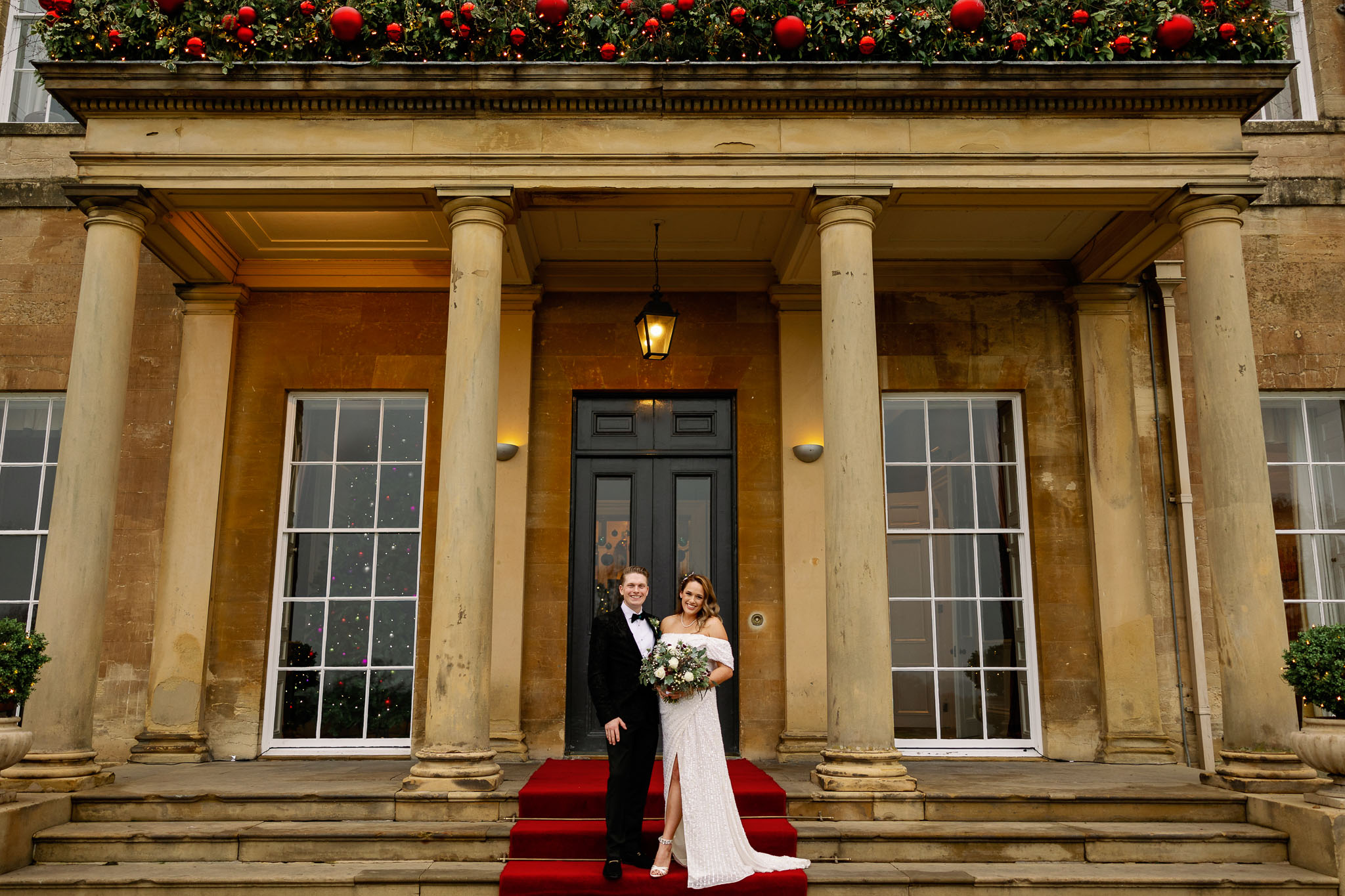 Bride and Groom outside the front entrance of Rudding Park 