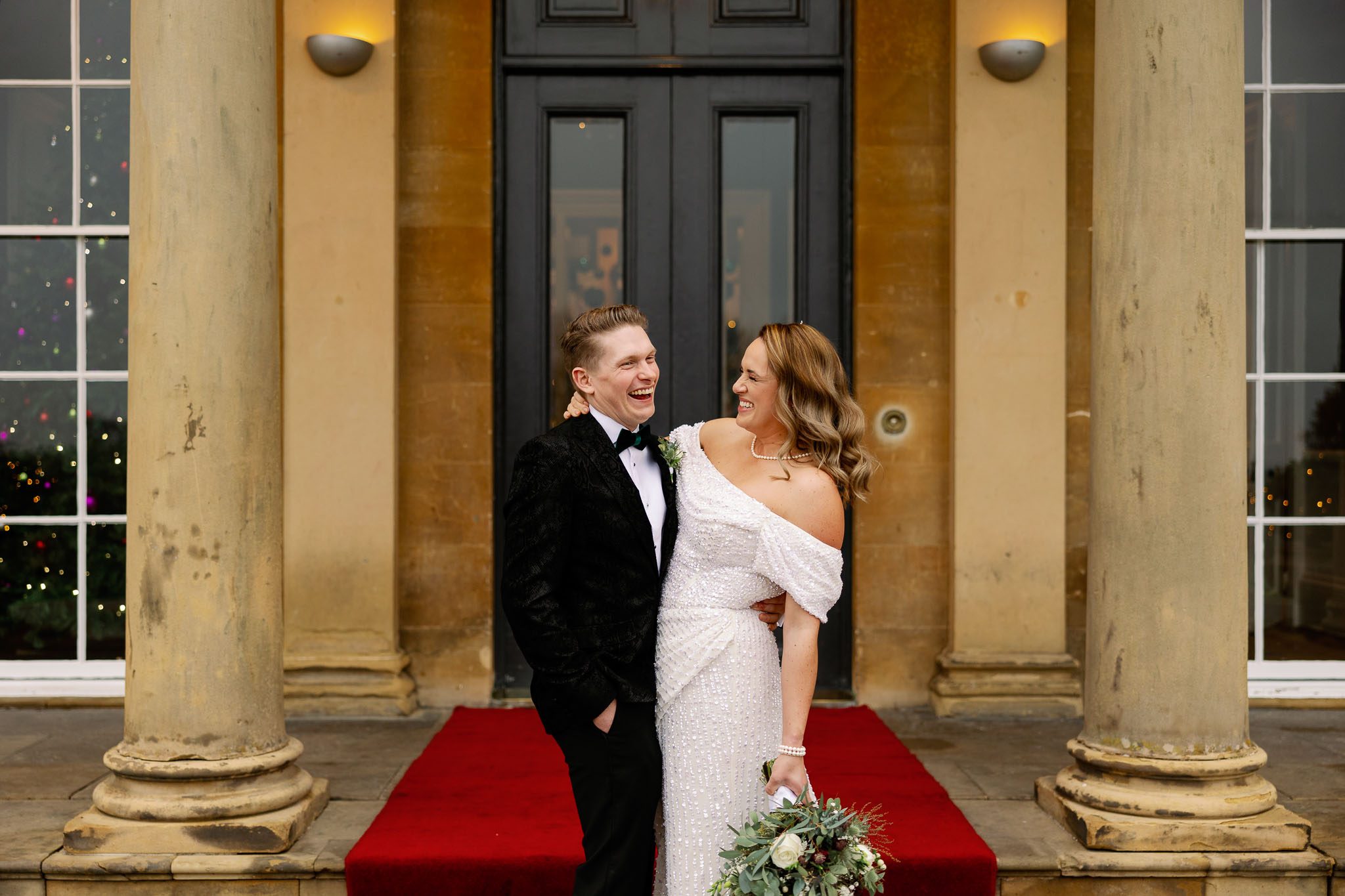Bride and Groom Portraits laughing at a Yorkshire Wedding 