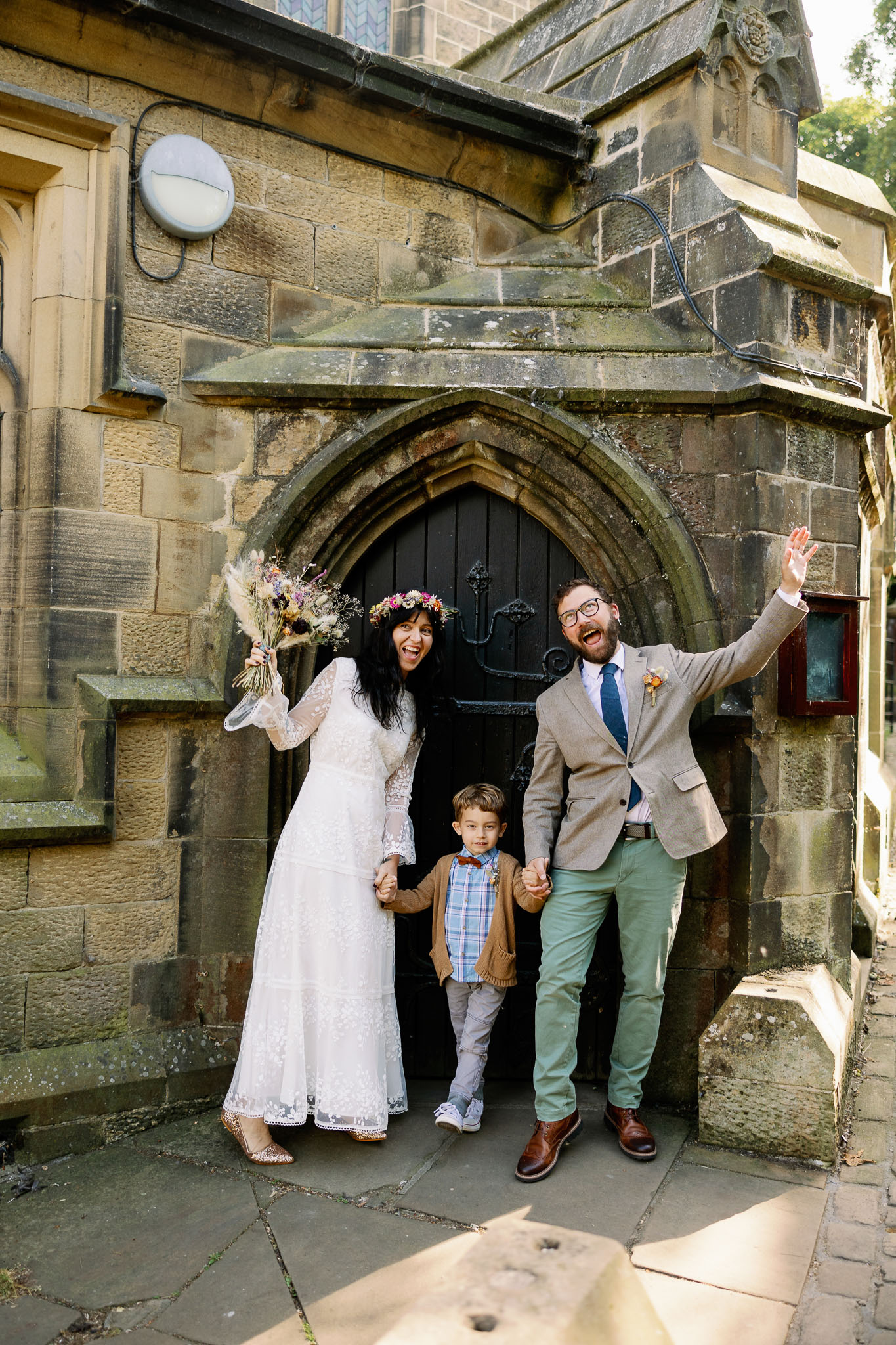 Wedding Couple outside the church in Haworth in Summer 